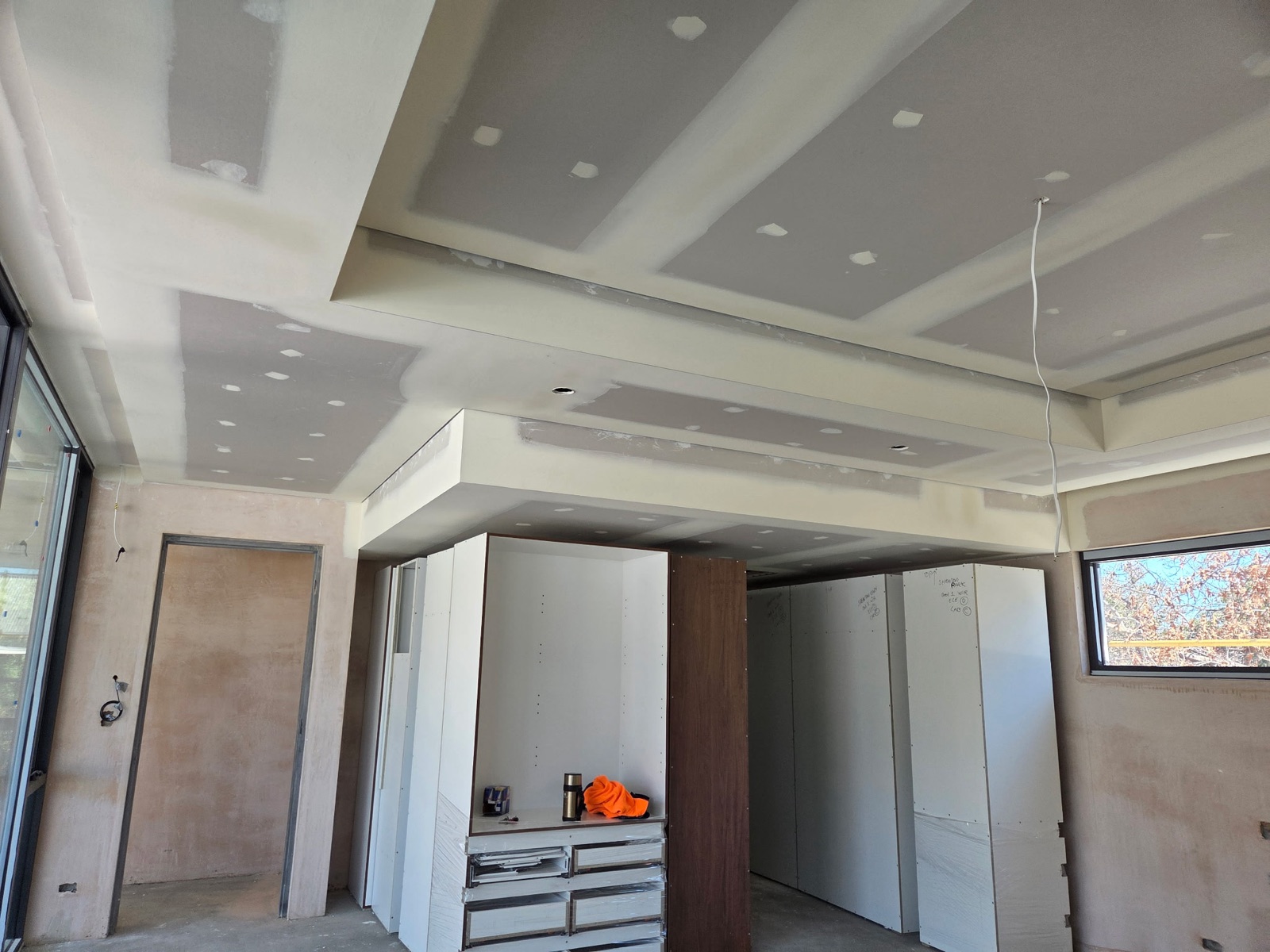 Stepped multi-level bulkhead ceiling above built-in robes in a new build, Perth