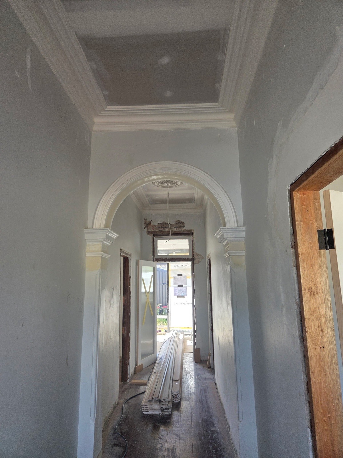 Heritage hallway with ornate archway, corbels and decorative cornice trim, Perth renovation